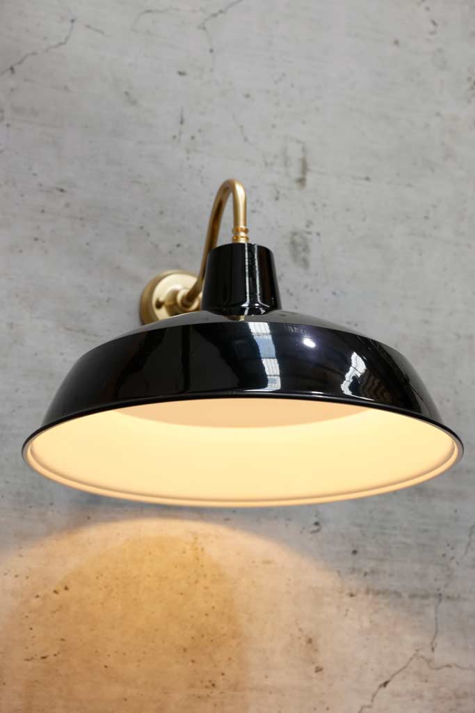 black shade on polished brass wall sconce