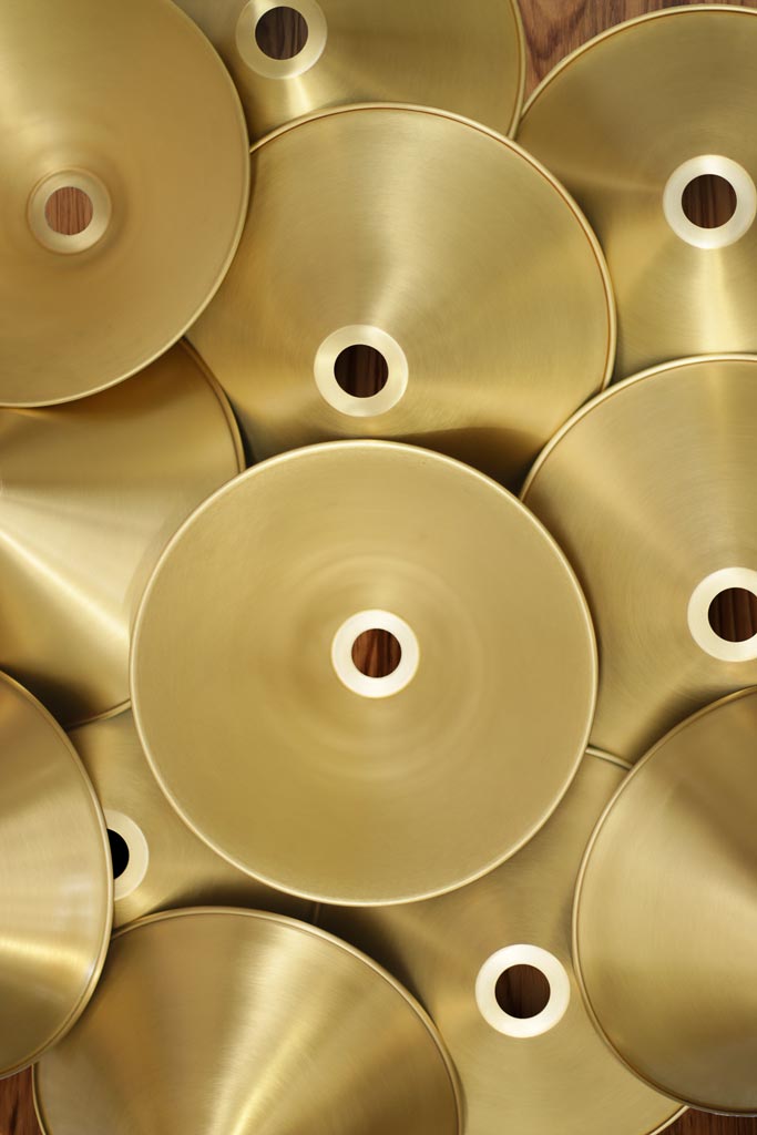 Bright brass cone shades close up