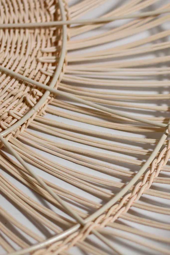 Close-up of the handcrafted interior of the rattan pendant shade, showcasing its artisanal touch.