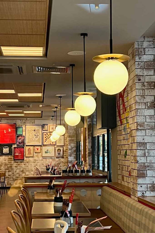 Brass Glass Ball Pole Pendant in restaurant