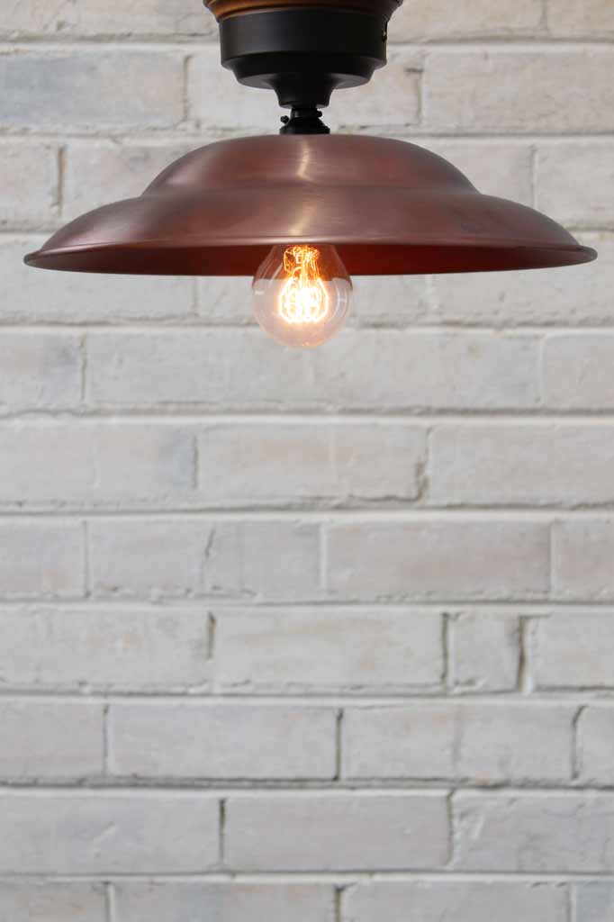 Barn Close To Ceiling Light with copper shade and black batten holder.