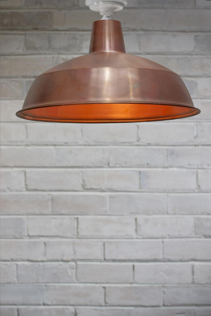 Large close to ceiling warehouse shade in copper with white batten holder.