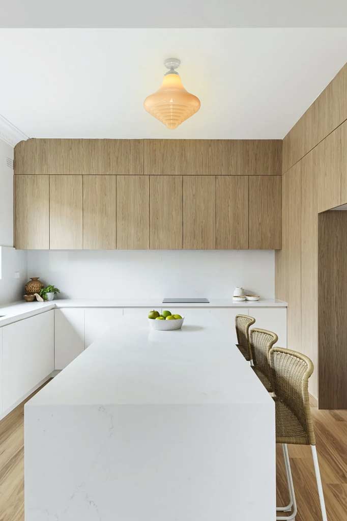 Opal glass ceiling light over kitchen island.