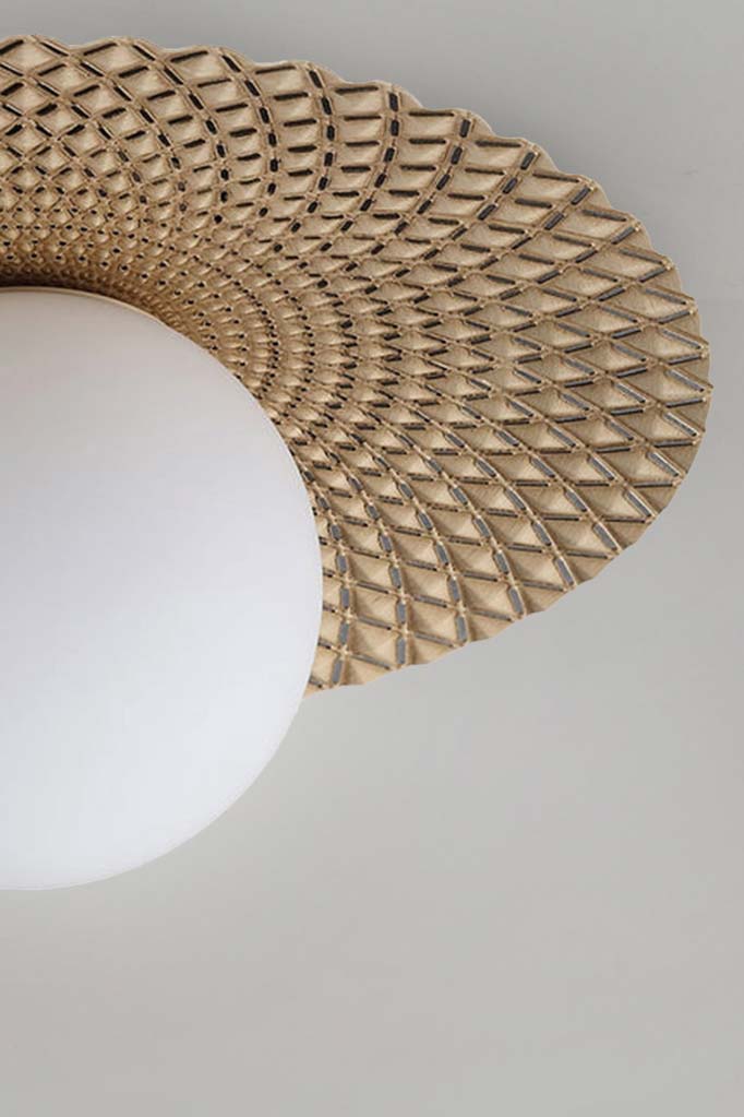 Close up of the Maramingo Glass Ceiling Light in gold, with a gold metal flat design and opal glass ball