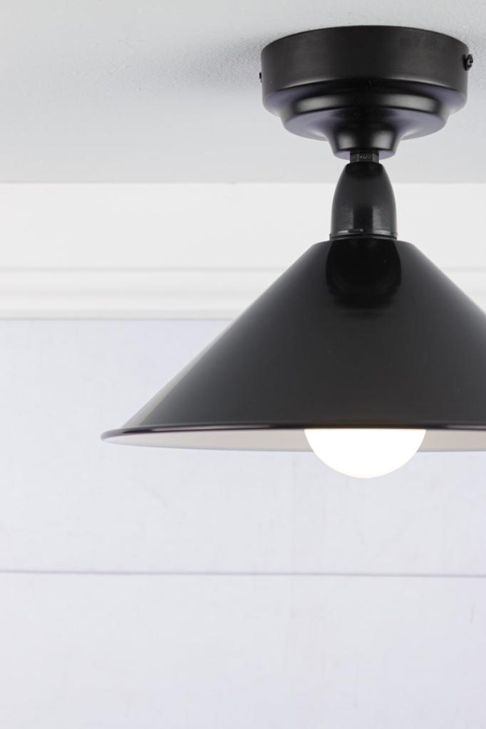 small black cone shade on a black IP rated battenholder.