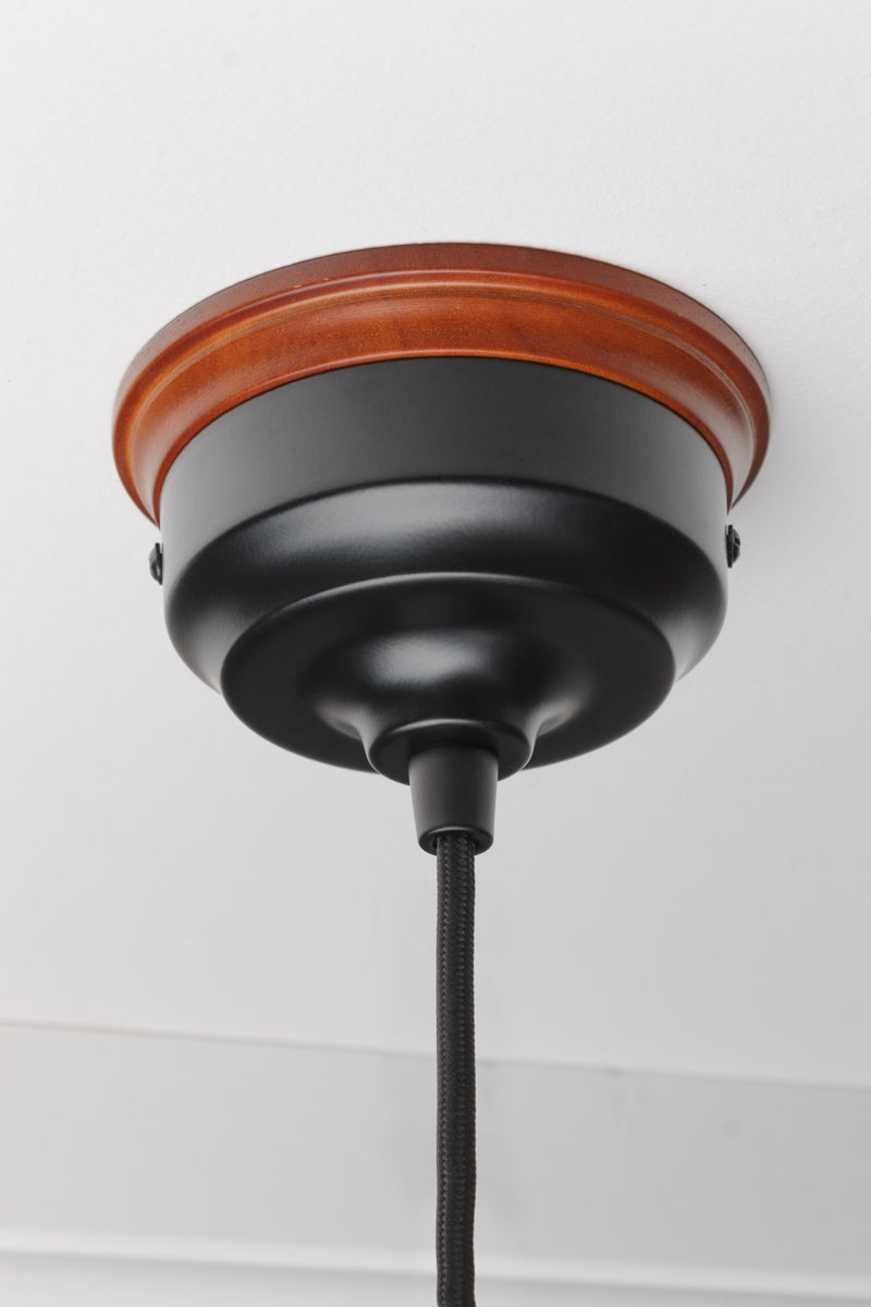 Black ceiling rose with old style wooden mounting block