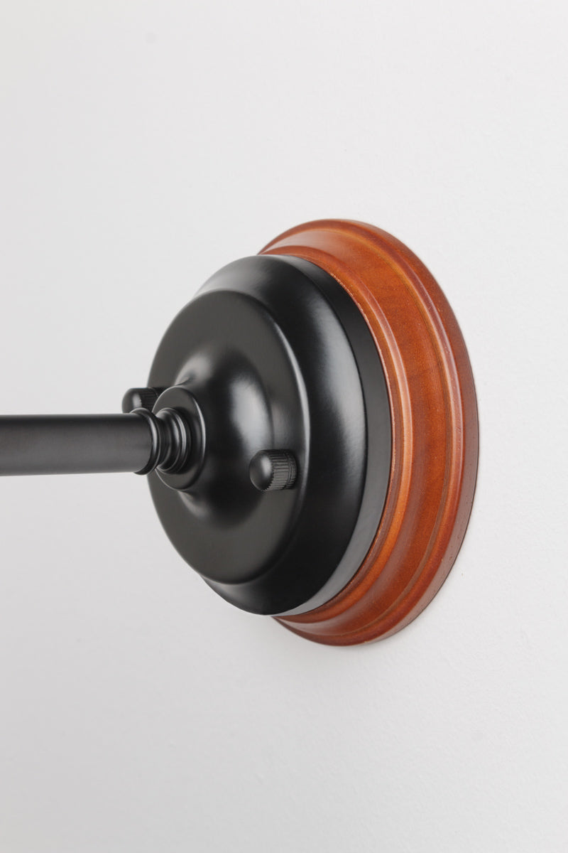 Wood mounting on a curved ceiling rose with a black pole