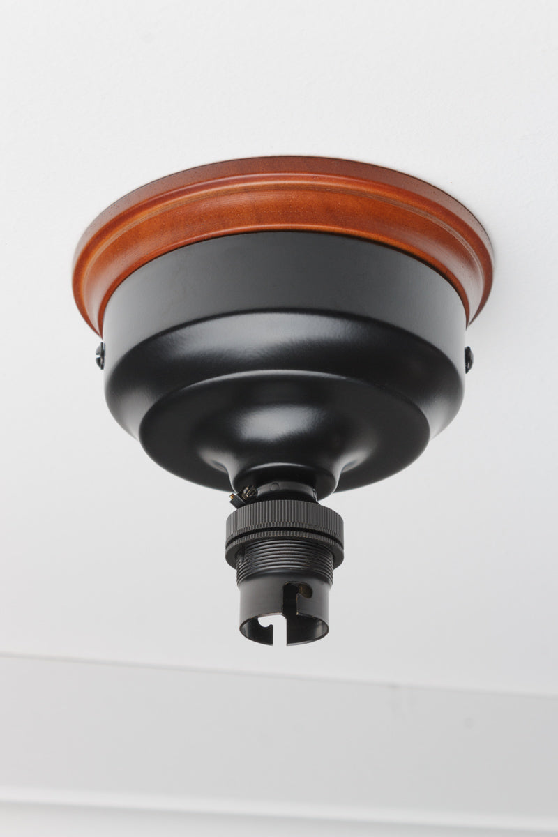 Wood mounting block with black ceiling rose and lampholder