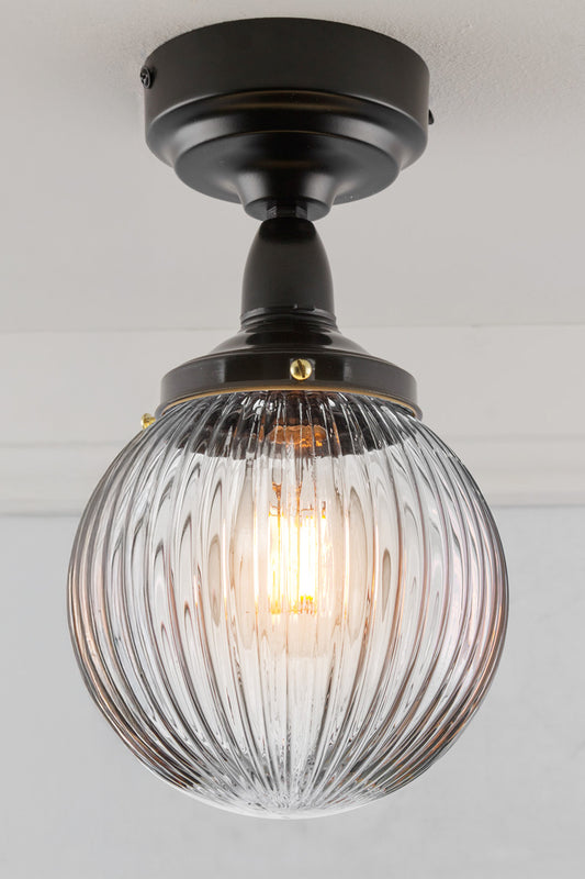 Clear reeded glass ball shade on an IP rated flushmount