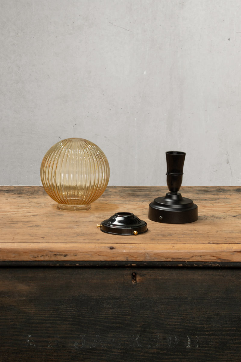 Dismanteled amber reeded glass ball shade on an IP rated flushmount