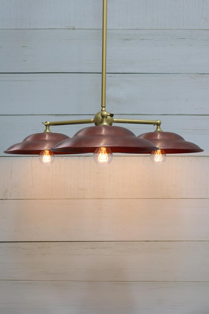 Barn Triple Arm Pendant with steel gold/brass arm and copper shades.