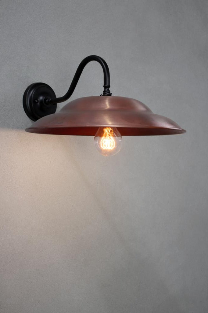 Barn Wall Light with a copper shade and black gooseneck scone.