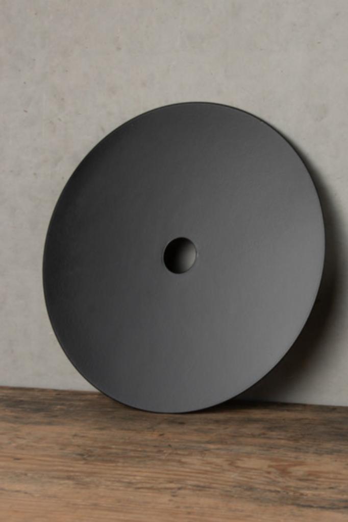 Large black metal disk