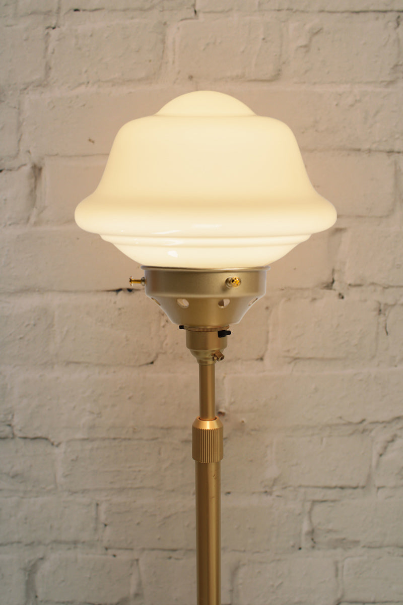 Close up of the gold/Brass floorlamp with small chelsea opal schoolhouse shade. 