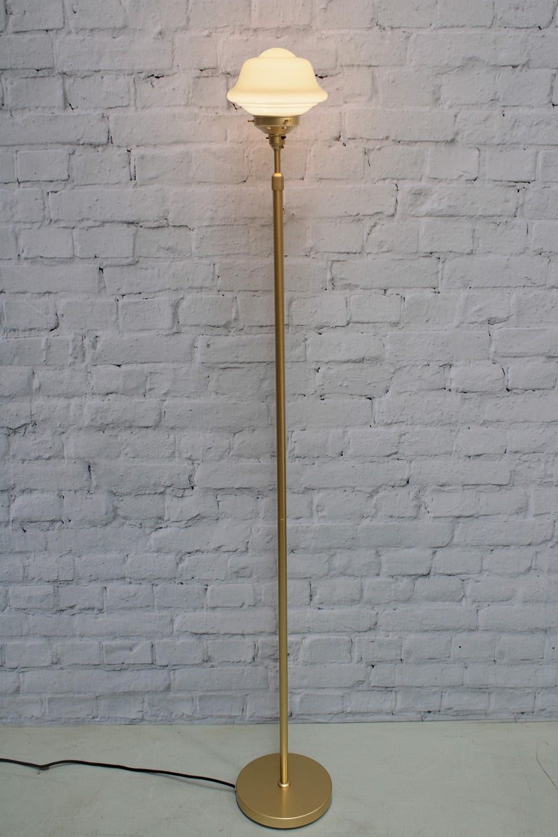 Gold/Brass floorlamp with small chelsea opal schoolhouse shade. 