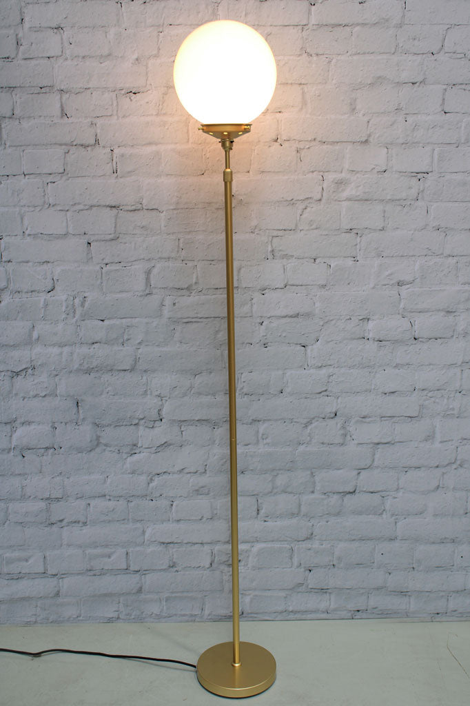 Medium opal glass ball shade on a gold/brass lamp stand