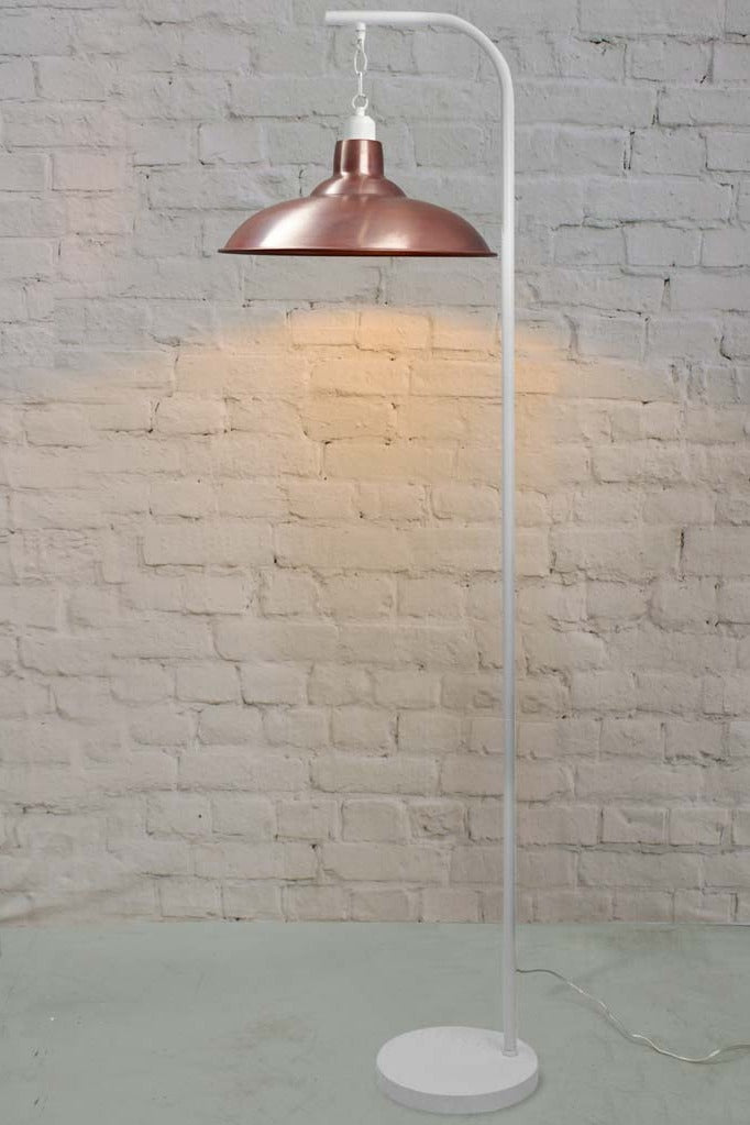 floor lamp with suspended aged solid copper finish shade and white stand.