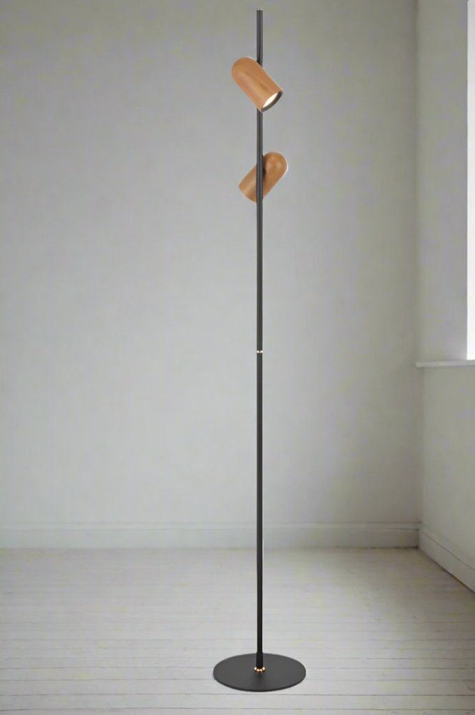 Angled view of a twin floor lamp with wood look shades and a black stand.