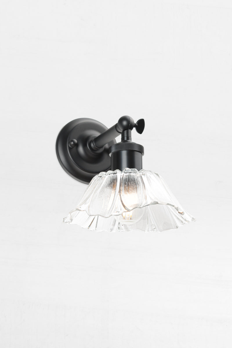 Barfleur is a small glass shade with black wall arm