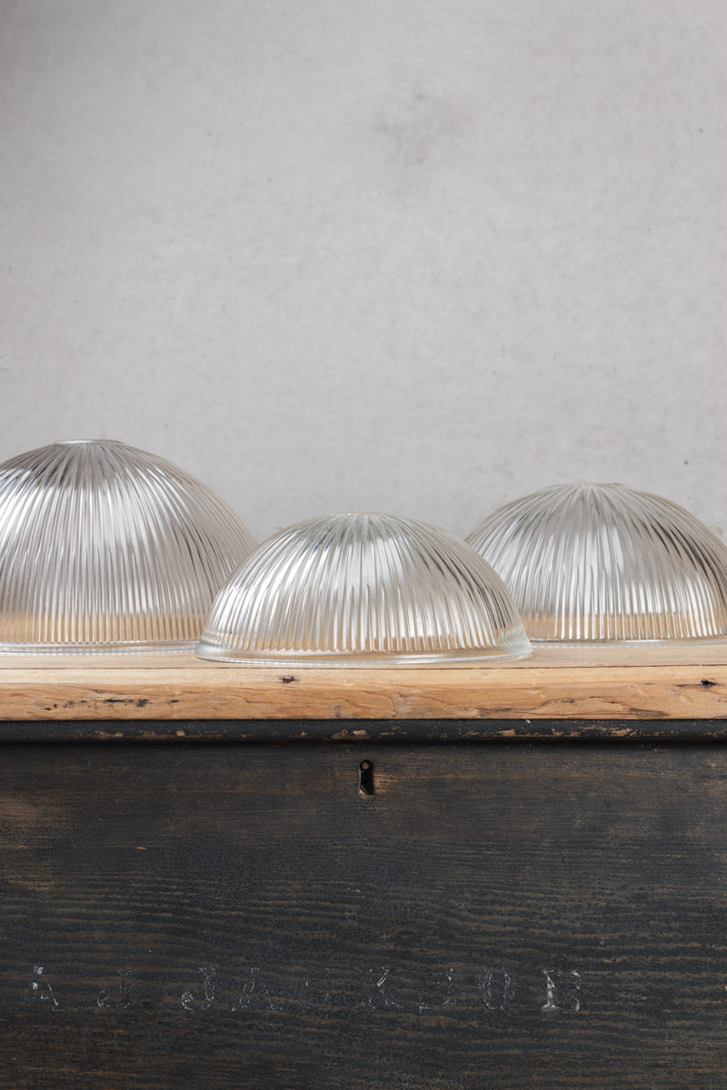 Three sizes of ridged glass shades in clear. 