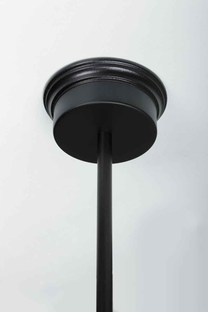 Mounting block installed on a black flat ceiling rose and black pole. 