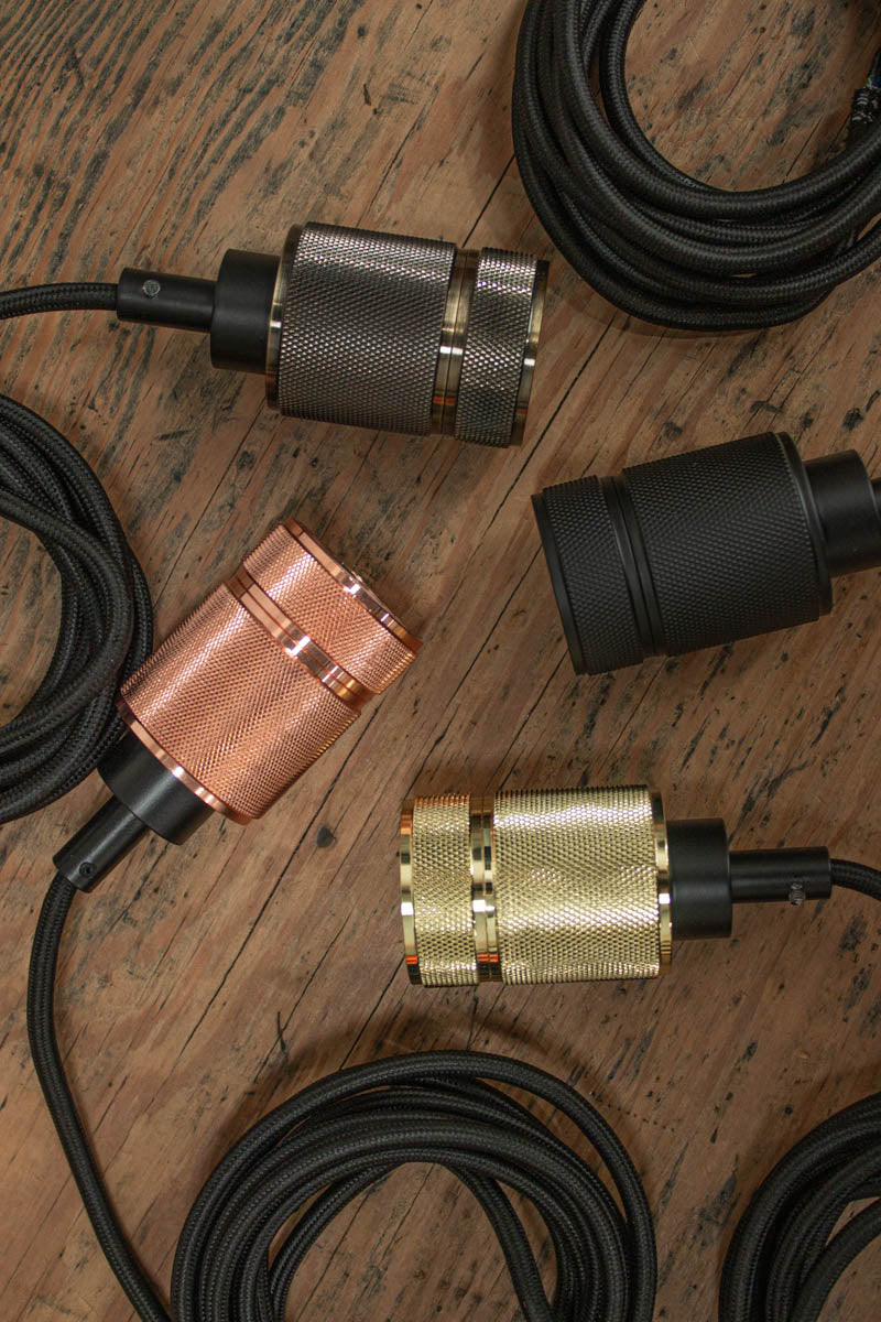 Four colour options of the Knurled Metal Lamp Holder.