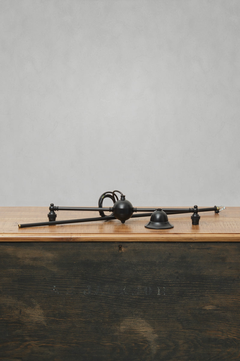 Brass double arm fixture in matt black. 