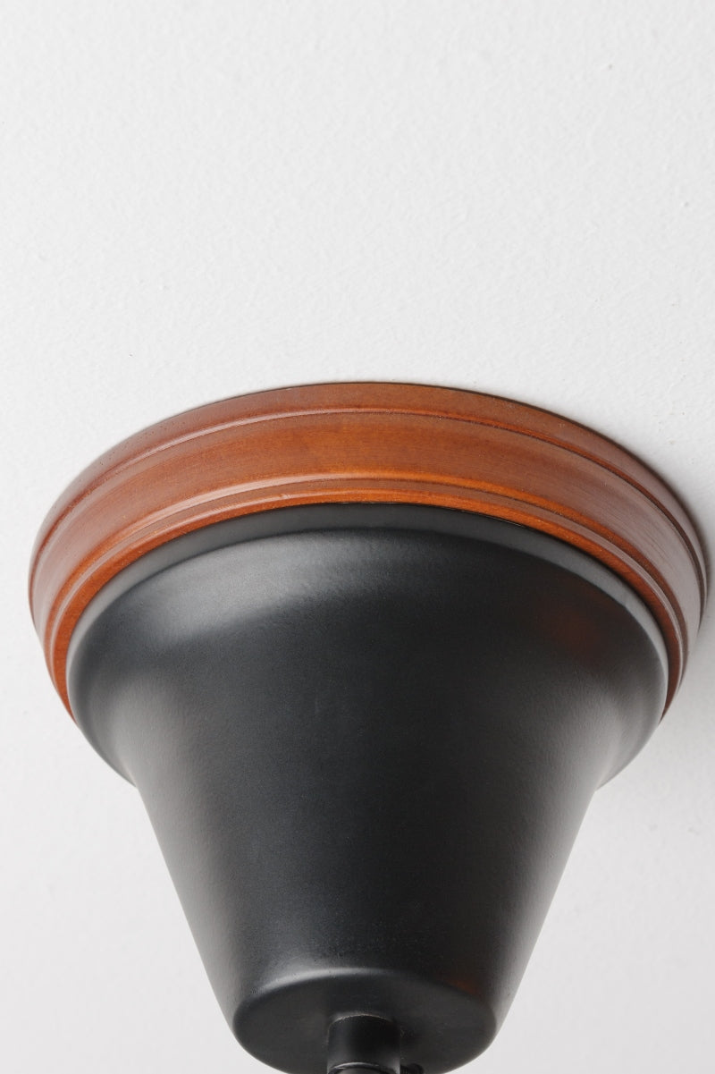 wooden mounting block with black ceiling rose