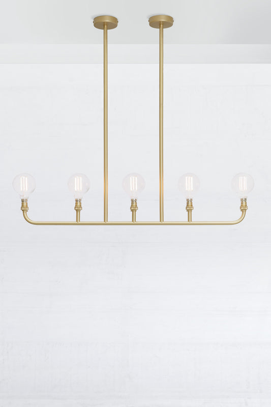 Five lamp linear chandelier in gold/brass. 