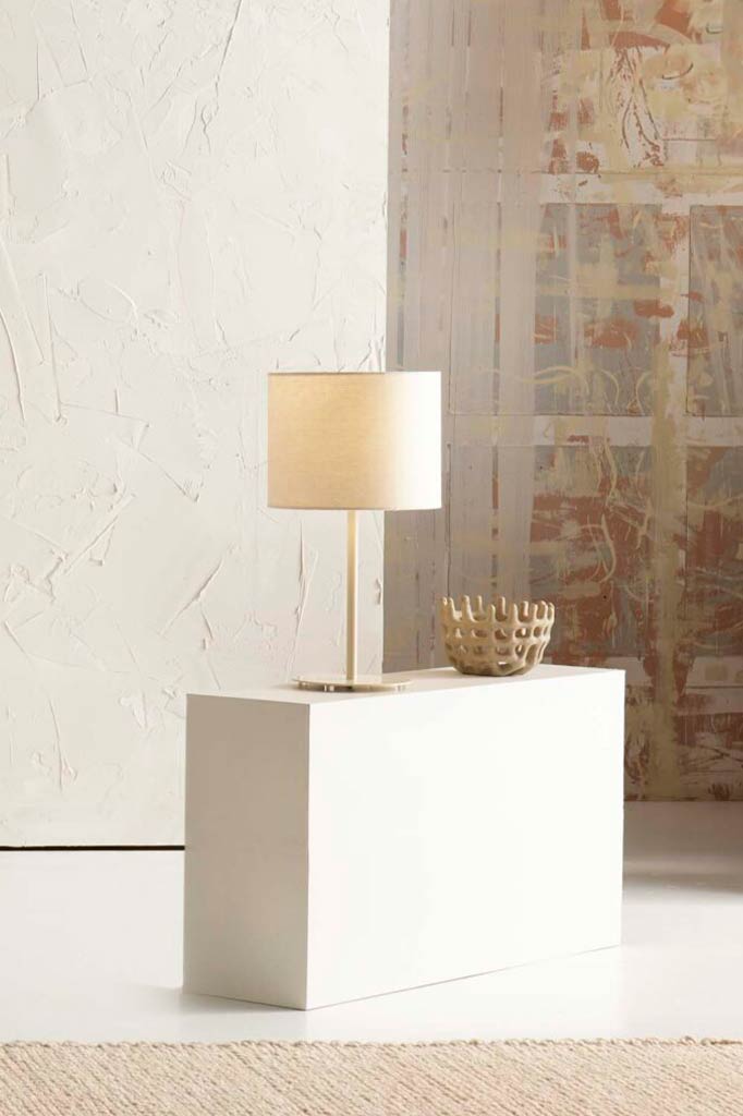 Cream table lamp above a coffee table