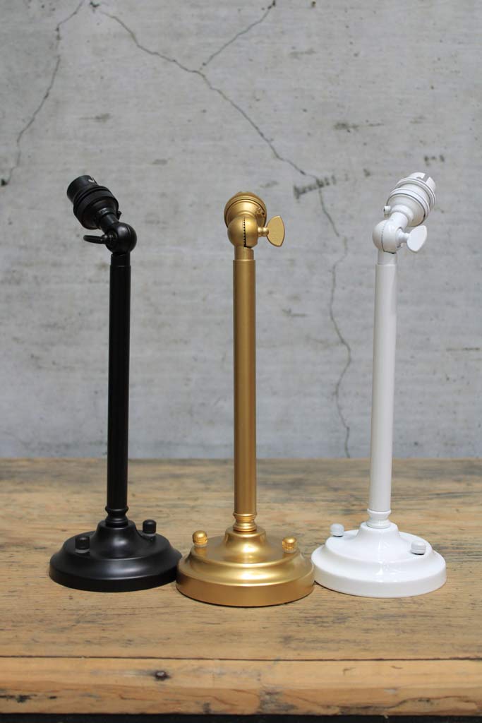 long adjustable wall sconces in black, white and gold/brass finishes