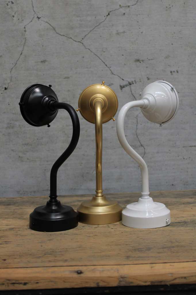 Exterior gooseneck wall sconces in black, gold/brass and white