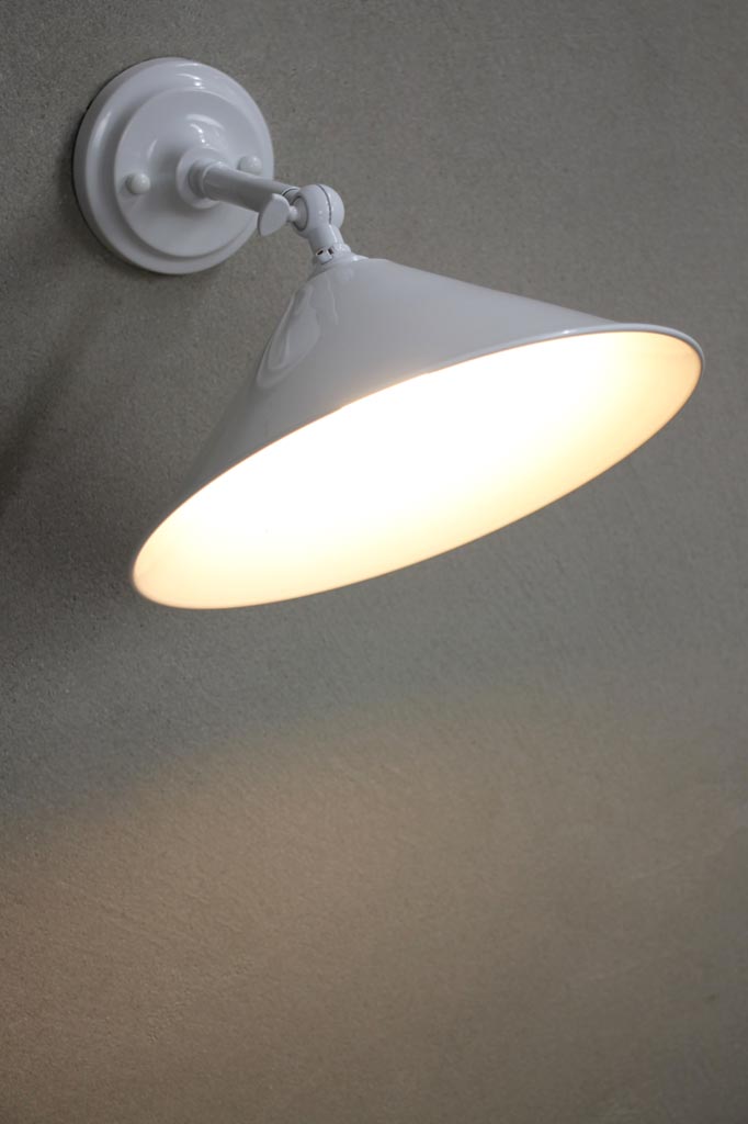 Small white cone wall light with white arm