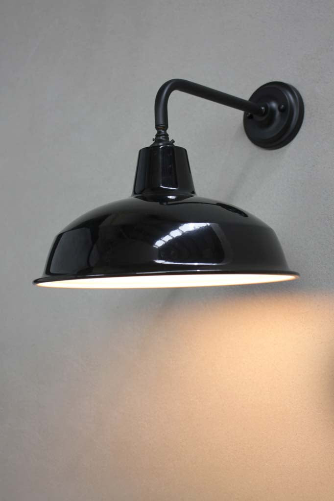 Warehouse shade in black with black wall sconce.