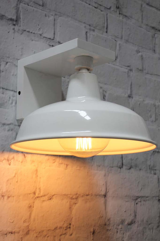 White steel warehouse shade on a white timber 90 degrees angled wall sconce.