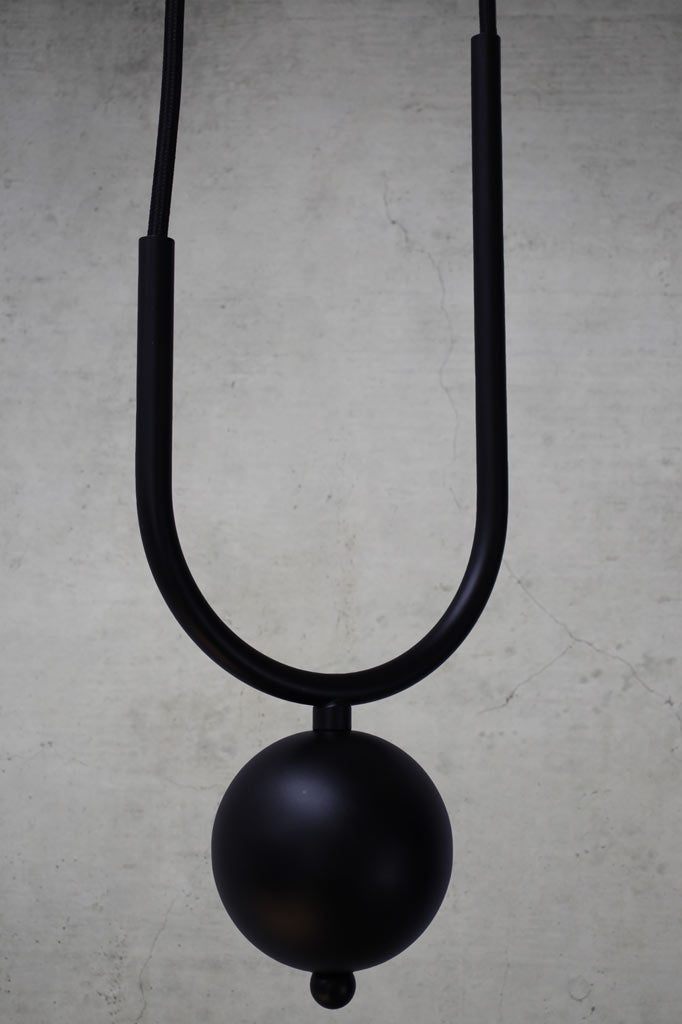 Weighted sphere and metalware in black finish