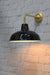 Warehouse shade in black with gold/brass wall sconce.