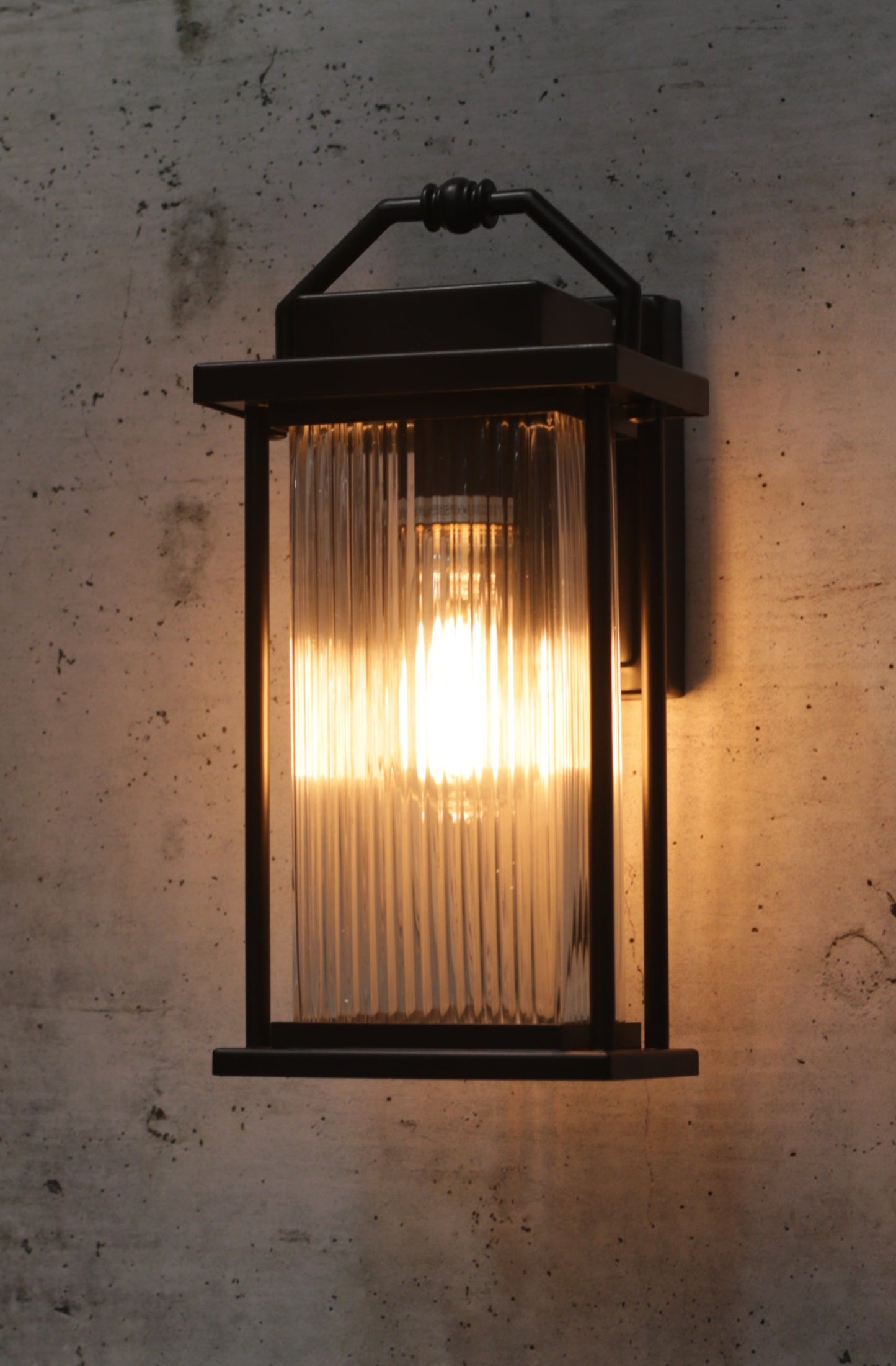 black wall light with ribbed glass ideal for verandah lights or bathrooms