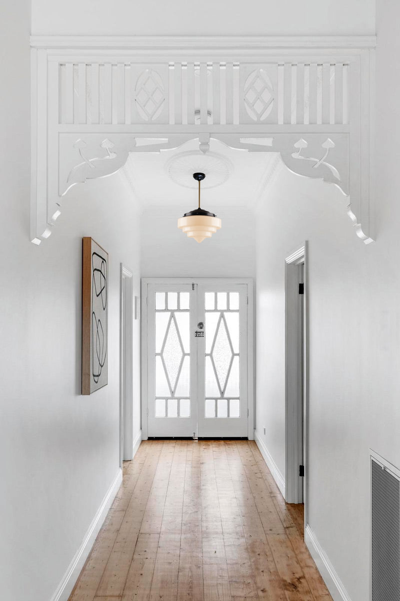 Schoolhouse Pole Pendants in hallway