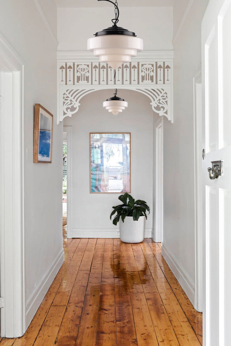 large Pensacola Deco Pendant Light on black chain cord in hallway