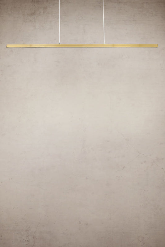 Gold/brass linear pendant light with stainless steel cables