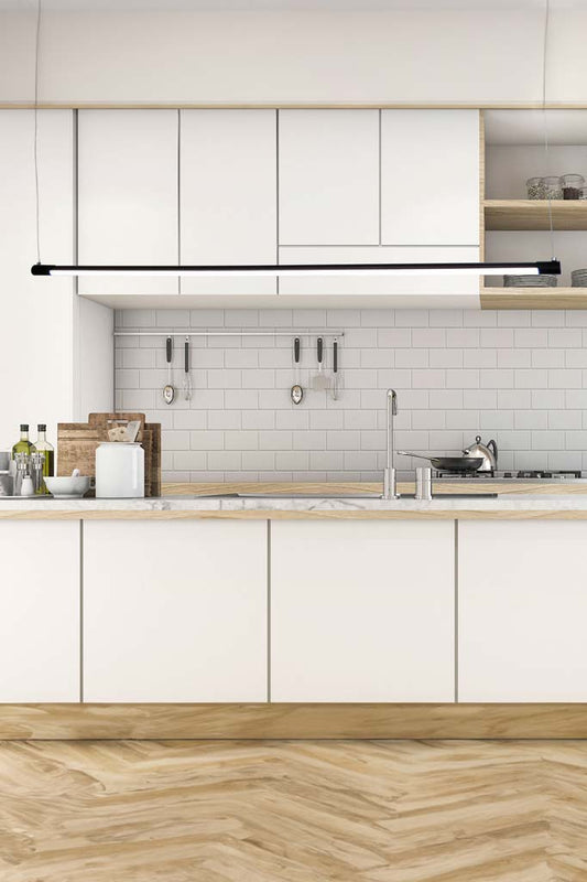 Bremer liner pendant hanging in a white and timber kitchen.