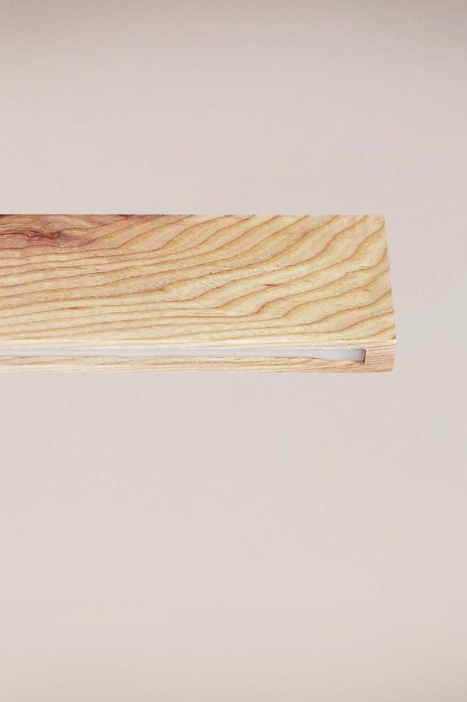 Close up of the Lancelin wood pendant, showing the unique grain. 