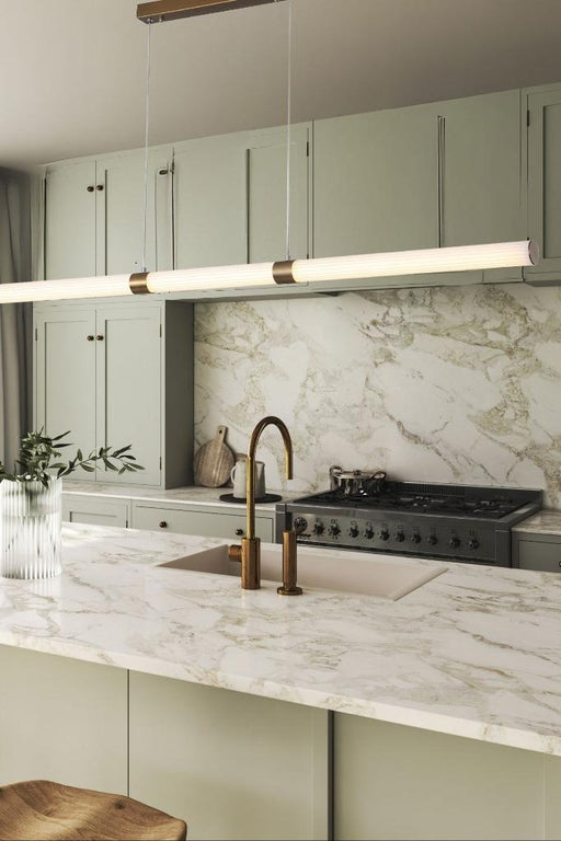 Reeded tubular linear pendant in a kitchen.