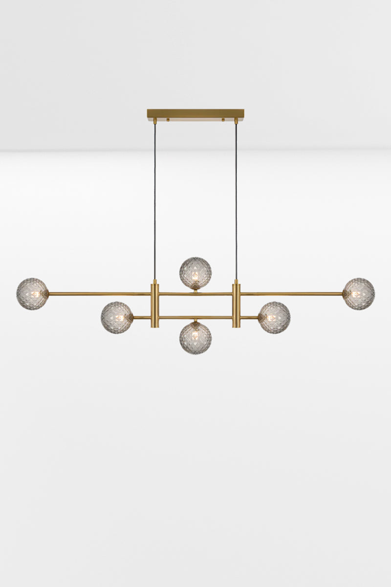 Six light Gold pendant with an art deco vibe and Smoke Tear glass ball shades. 