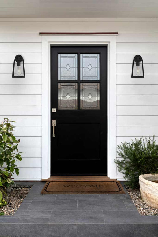 two black wall lights in the front door entrance