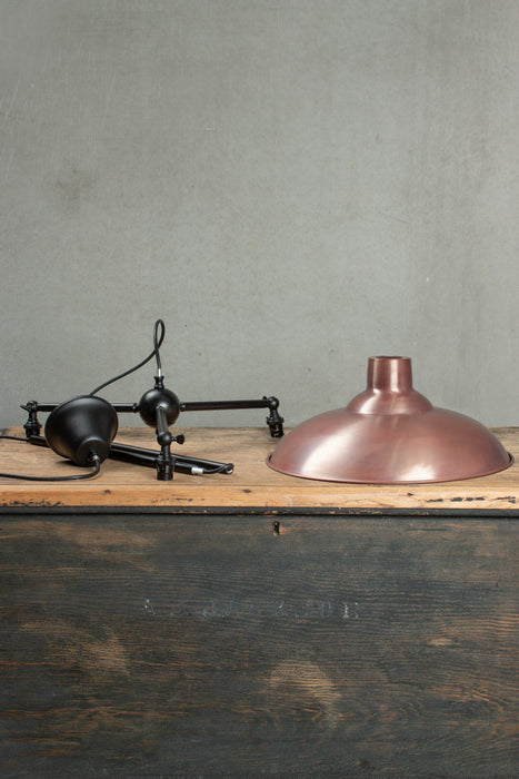 Bullpit shade in Aged Solid Copper with a black 3 arm fixture