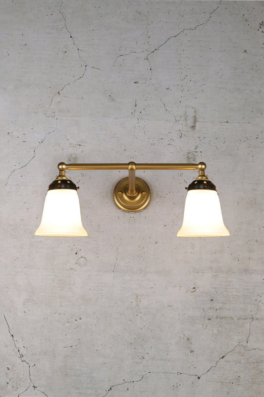 Gold double arm wall light with opal glass shades