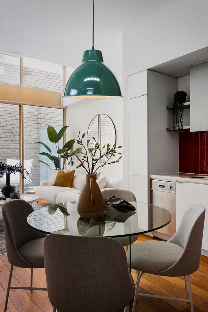 federation green loft pendant light over a dining table.