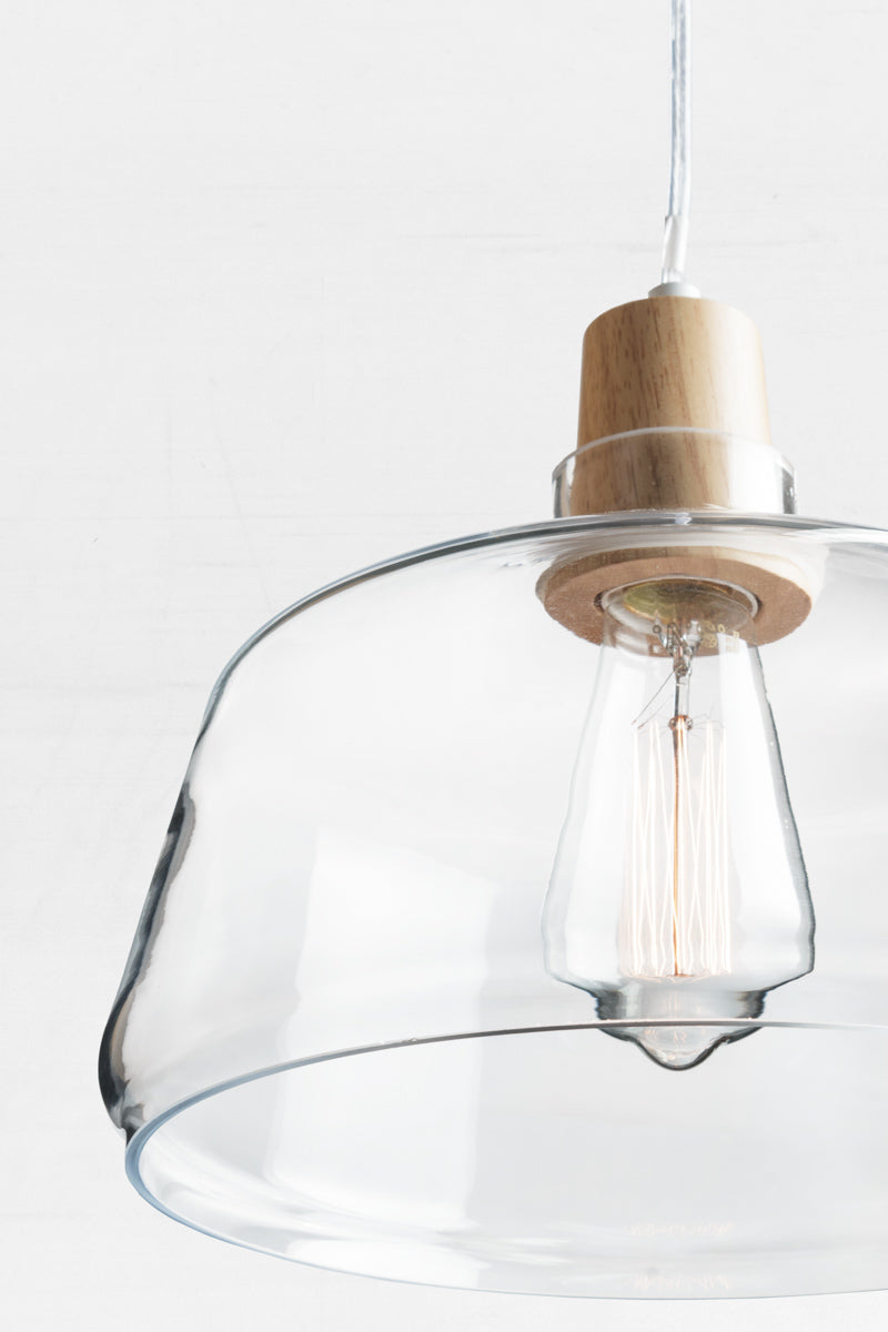 Close up of the large wood top glass light pendant with led bulb